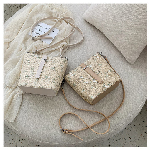 Title 3, Straw bucket bag with lace embroidery. A stylis...