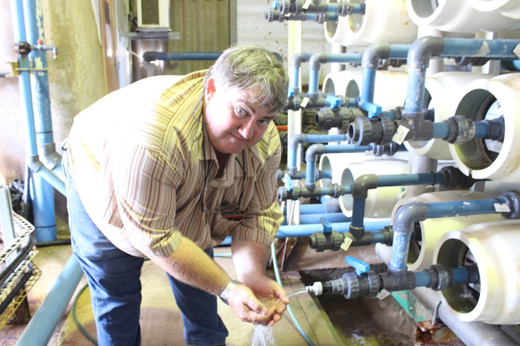 TASTE TEST: The regional manager for Amatola Water, Andre Dyer, tastes the water from a tap at the end of the desalination and reverse osmosis process at the Albany Coast Reverse Osmosis plant at Bushman’s River Mouth n Thursday. In contrast to severe water shortages last December, the holiday area’s supply has been boosted by 60% to 1.8 megalitres a day following an upgrade