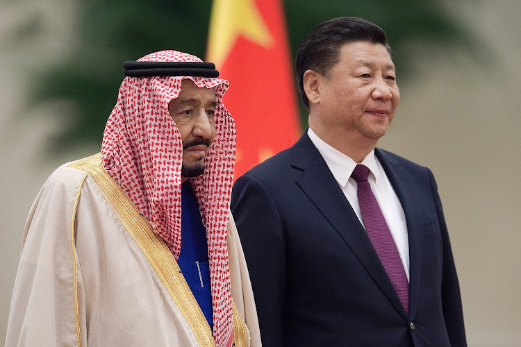 (FILES) In this file photo Saudi King Salman bin Abdulaziz (L) stands with Chinese President Xi Jinping (R) during a welcoming ceremony at the Great Hall of the People in Beijing on March 16, 2017. When Chinese President Xi Jinping visits Saudi Arabia from December 7, 2022, the oil-rich kingdom will seek mostly economic gains rather than a meaningful shift away from its long-time protector the United States, analysts say. Xi will arrive for a three-day visit including meetings with Saudi royals, the regional Gulf Cooperation Council and other Middle East leaders, Saudi state media said. (Photo by NICOLAS ASFOURI / AFP) / NO USE AFTER JANUARY 5, 2023 12:05:06 GMT