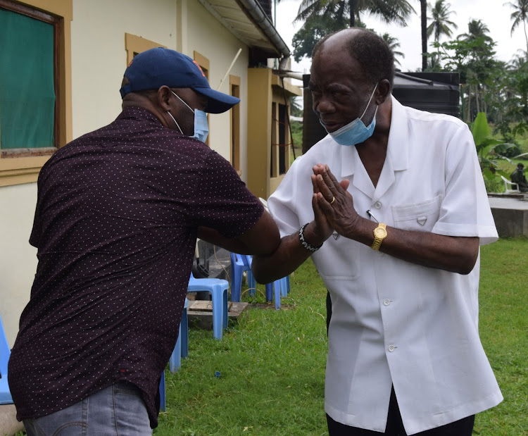 Kaloleni MP Paul Katana and former Cabinet Minister Noah Katana Ngala at Esther Ngala's burial at Vishakani in Kaloleni on Saturday.