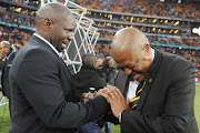 A file photo of Kaizer Chiefs head coach Steve Komphela (l)  and Football Manager Bobby Motaung during the 2016 Carling Black Label Champion Cup match against Orlando Pirates at FNB Stadium on July 30, 2016 in Soweto, South Africa. 