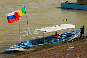 Russian and Malian flags on a canoe during the Festival sur le Niger, also known as Segou'Art, as it occurs in the wake of Mali and its neighbours Niger and Burkina Faso leaving Ecowas in Segou, Mali.