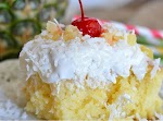 Pina Colada Poke Cake was pinched from <a href="http://kitchenmeetsgirl.com/desserts-2/pina-colada-poke-cake/" target="_blank">kitchenmeetsgirl.com.</a>