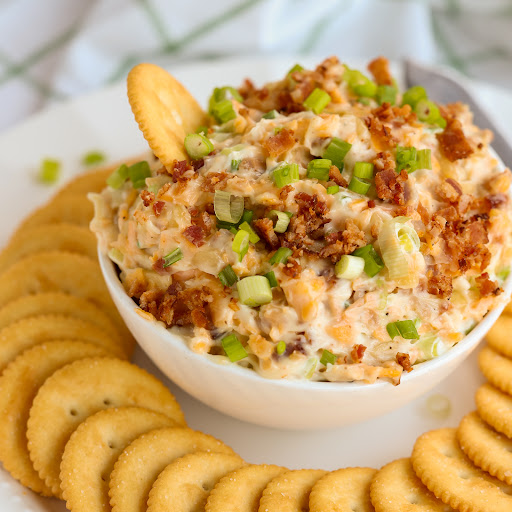 This quick and easy Million Dollar Dip is a friend and family party favorite with crisp bacon, sharp cheddar, almond slivers, and green onions.  Serve with buttery crackers, tortilla chips, bagel chips, carrot sticks, or celery sticks.