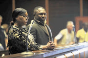 BACK IN COURT: Sheryl Cwele and Frank Nabolisa  during their conviction by the Pietermaritzburg High Court in May last year for dealing in drugs. Photo: JACKIE CLAUSEN