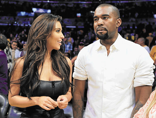 Kim Kardashian and Kanye West at a Los Angeles Lakers-Denver Nuggets basketball game.