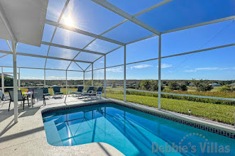 Relax and enjoy the scenic view from the sunny pool deck at this Highlands Reserve vacation villa