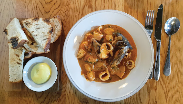 Bones Kitchen and Bar's cioppino – a mellow tomato-based fish stew – is worth going back for.