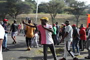 Protesting students on Monday retaliated against the police after water cannons were used to disperse them.