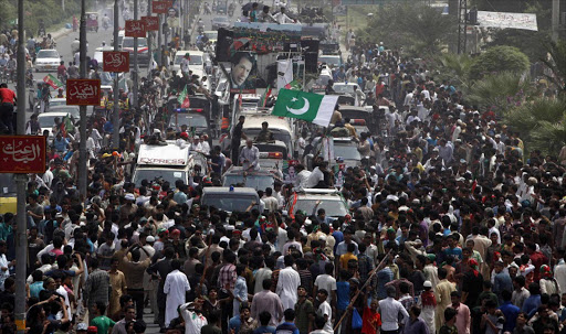 Supporters of cricketer-turned-opposition politician Imran Khan take part in the Freedom March in Gujranwala.