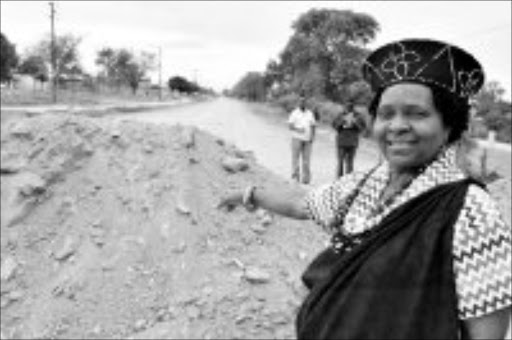 VISIONARY: Lwandlamuni Felia N'wamitwa-Shiluvhana, who will be the chief of Valoyi tribe, has fought for improved service delivery. She is seen inspecting progress on the construction of the tar road. Pic. Elijar Mushiana. 11/06/08. © Sowetan.