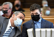 FILE IMAGE: Kyle Rittenhouse listens to his attorney Mark Richards during his pretrial hearing at the Kenosha County Courthouse in Kenosha, Wisconsin, US, May 21, 2021.