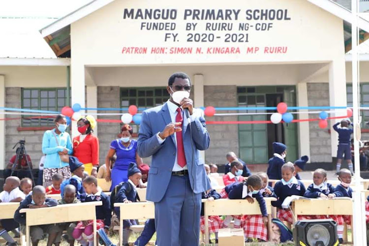 Ruiru MP Simon King'ara addresses parents and learners at the new Manguo Primary School in Githurai 45 on Monday.