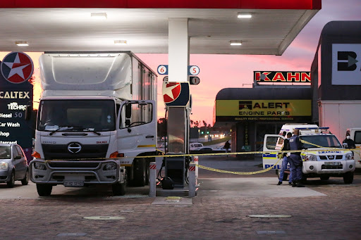 September 28, 2021 - SAPS cordon off the scene of a robbery at the Caltex filling station in Cape Road. Pierre Potgieter, who chased after the suspects, died in hospital on Wednesday.