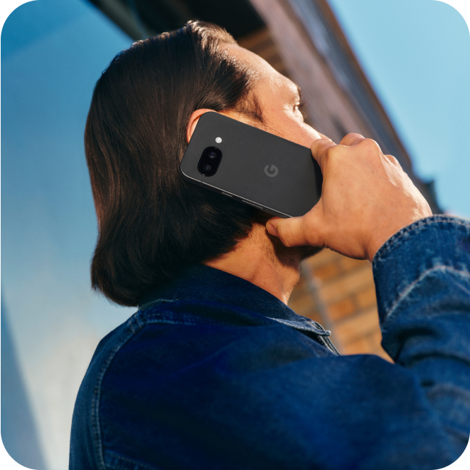 A man talking on his Google Pixel 9a phone.