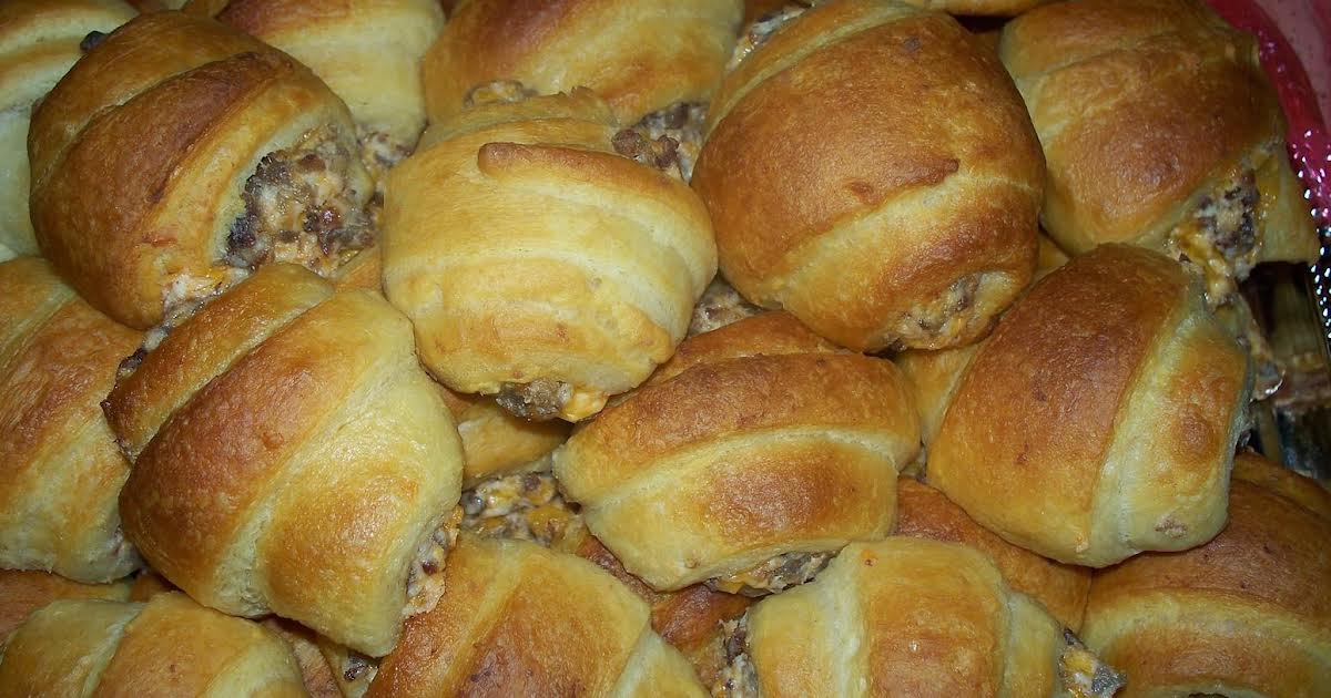 Prepping the cream cheese and sausage filling in Pillsbury Crescent dough  sheets - The Southerly Magnolia