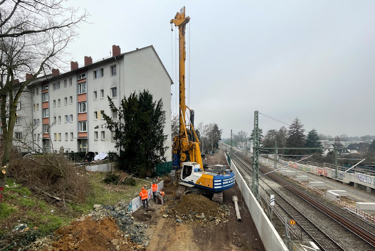 Staff works beside railroad tracks as an IT failure at Lufthansa stranded passengers and forced flights to Germany's busiest airport to be canceled or diverted in Frankfurt, Germany, February 15, 2023, with the airline blaming botched railway engineering works that damaged broadband cables.