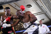 Cristiano Ndombassy.,left, and Khensahosi Makondo exchange leather on Sunday. 