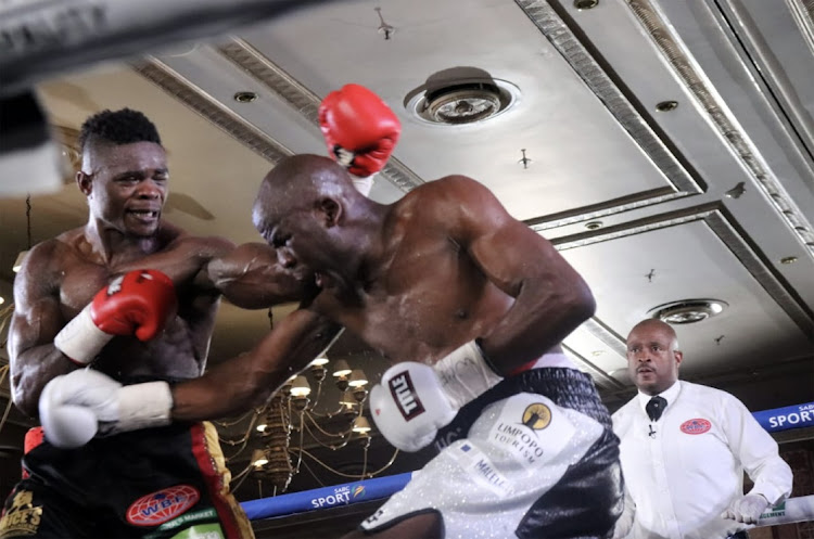 Cristiano Ndombassy.,left, and Khensahosi Makondo exchange leather on Sunday.