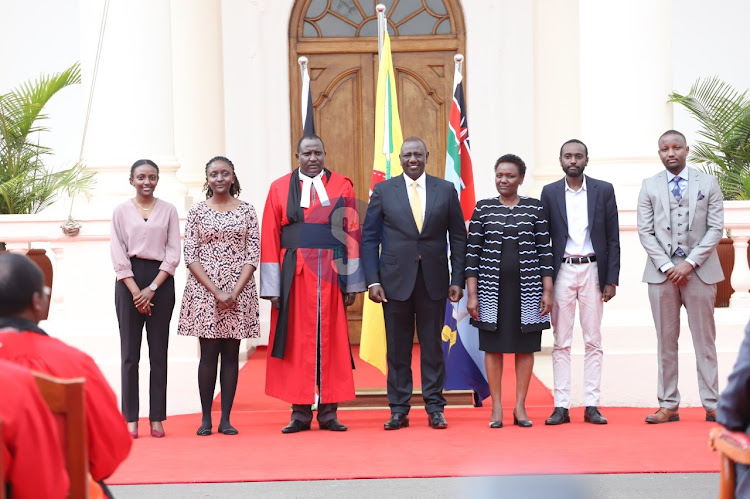 Court of Appeal Judge Korir Kipyegon family pose with President William Ruto during swearing in ceremony at State House, Nairobi on September 14,2022.