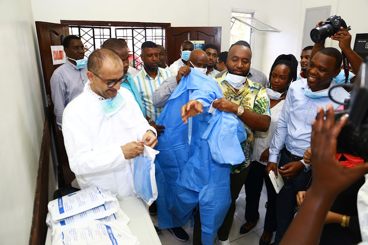 Mombasa Governor Hassan Joho wears the protective gear at the Coast General Hospital Isolation Centre on Monday.