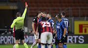 Zlatan Ibrahimovic of AC Milan is shown a red card by referee Paolo Valeri for his second bookable offence during the Coppa Italia match between FC Internazionale and AC Milan at Stadio Giuseppe Meazza on January 26, 2021 in Milan, Italy.