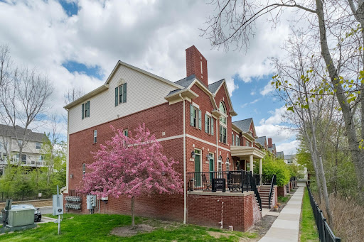 brick facade townhouses blooming trees in this luxury house for sale in Milford Charter Township ($265,000)