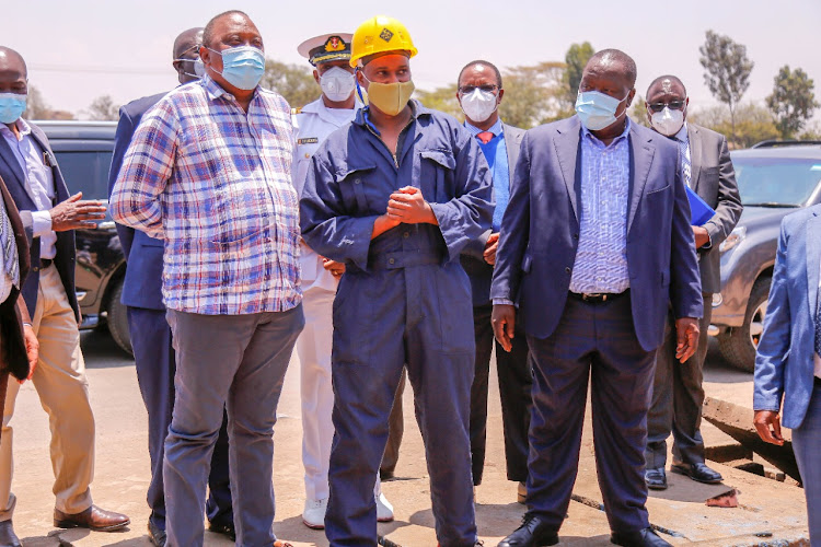 President Uhuru Kenyatta, Interior CS Fred Matiangi, Education CS George Magoha and Karanja Kibicho, visit Dean Achesa's workshop in Umoja, Nairobi,