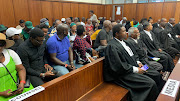 Some of the 65 alleged riots instigators appear in the Durban high court on Tuesday.