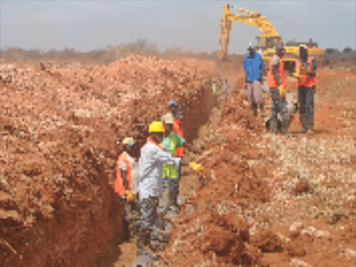 Workers constructing the main intake of the multibillion Galana-Kulalu Food Security project beside River Galana. The intake is expected to be ready in two weeks for pumping to begin while planting is set to start at the end of February.