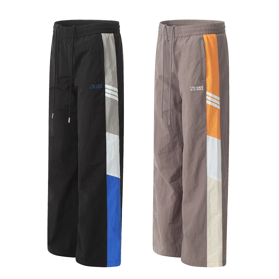 Muške sportske casual pantalone sa blokovima boja Udobne i moderne za svakodnevno nošenje i sportske aktivnosti Savršen stil za vas