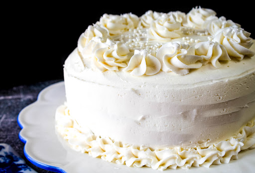 A cake iced with Yummy Vanilla Buttercream Frosting.