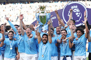 Ilkay Guendogan of Manchester City lifts the Premier League trophy following their match against Chelsea at Etihad Stadium on May 21 2023. 