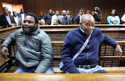 Former G4S prison warden Senohe Matsoara with his co-accused Zolile Sekeleni, the father of Dr Namdipha Madugumana, in the dock in Bloemfontein.