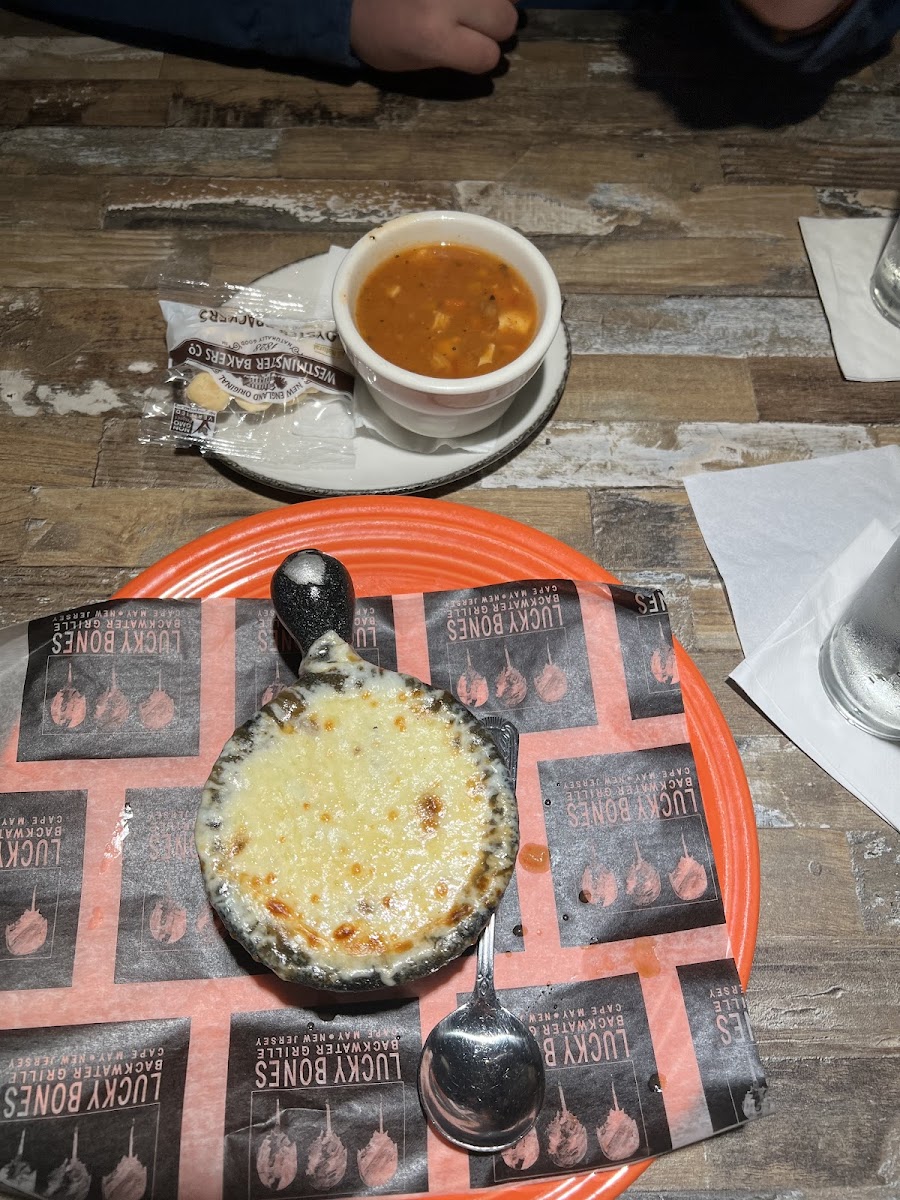 Gluten free French onion soup on orange plate