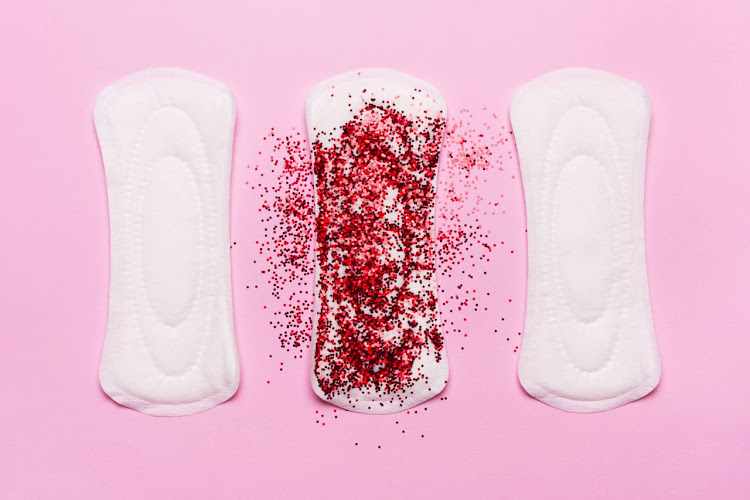 Sanitary pads sprinkled with red glitter powder.