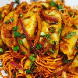 Chili Momos on Cheesy Tandoori Noodles - Dumplings