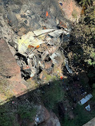 The wreckage of the bus in Limpopo. At least 45 people are thought to have died, but an eight-year-old girl survived and is being treated in hospital. 