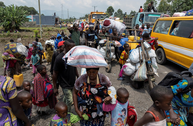 Congolese people carry their belongings as they flee from their villages around Sake, following clashes between M23 rebels and the armed forces of the Democratic Republic of Congo, February 7 2024. Picture: ARLETTE BASHIZI/ REUTERS