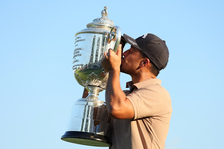 Xander Schauffele of the US kisses the Wanamaker Trophy after winning the 2024 PGA Championship at Valhalla Golf Club in Louisville, Kentucky on Sunday.
