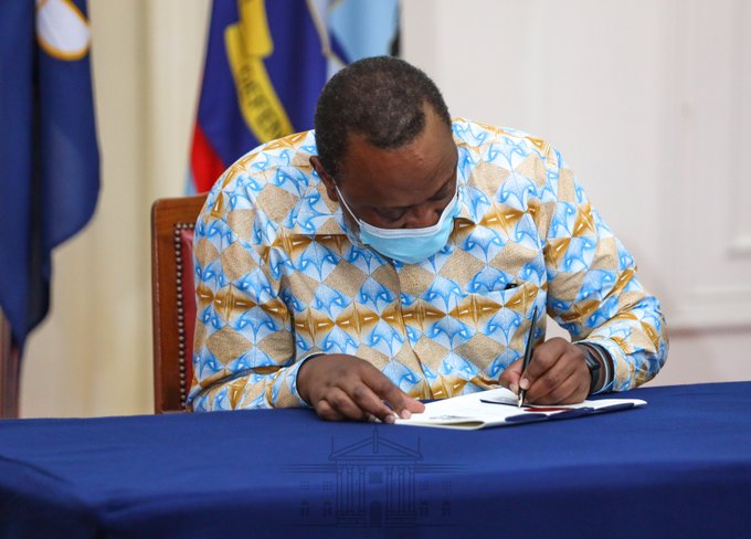 President Uhuru Kenyatta signs into law the Supplementary Appropriation Bill, 2020 on Thursday evening.