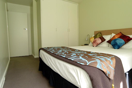 Bedroom at East Melbourne Albert Street Serviced Apartment