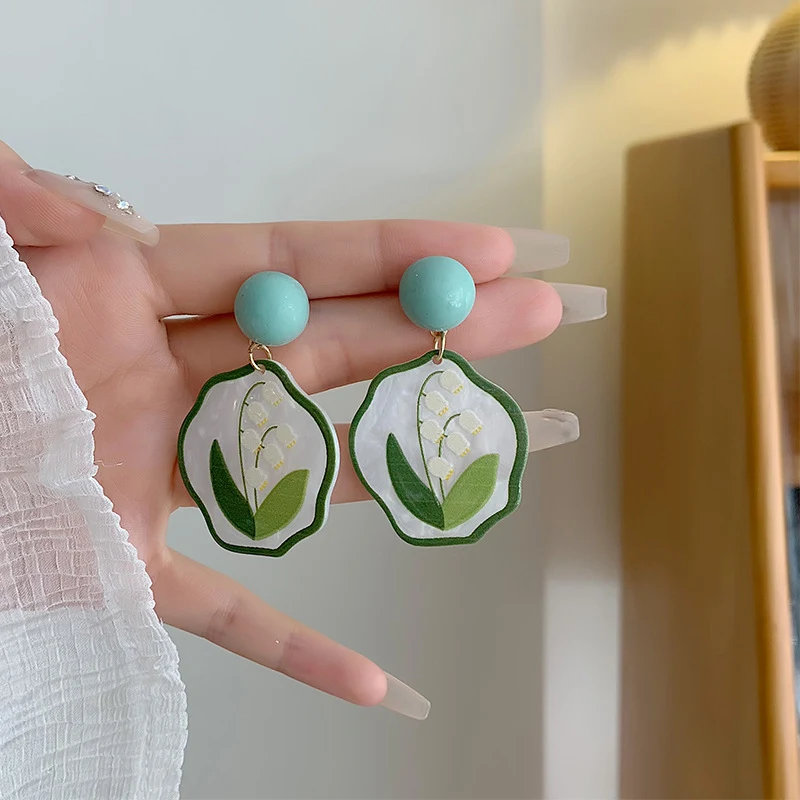 Lily Earrings Oil Painting Mori Style, handcrafted to bring artistic and natural charm to your look. Embrace bohemian el