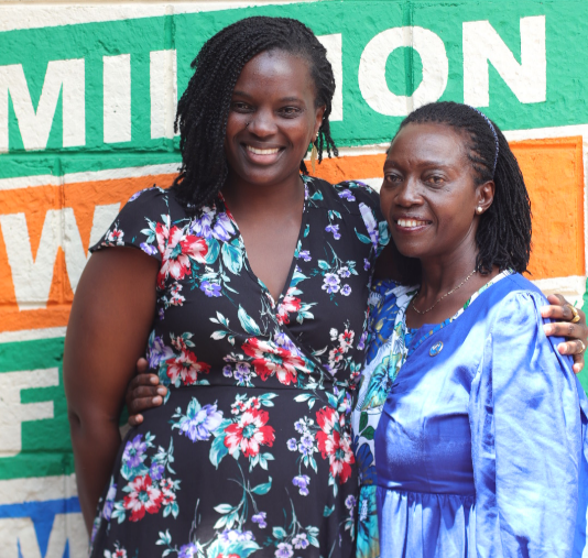 Azimio presidential running mate Martha Karua with a member of her campaign secretariat.