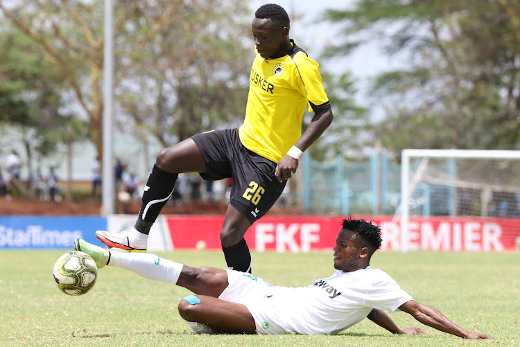 Kariobangi Sharks' Erick Mmata contests for the ball with John Njuguna of Tusker during their Premier League clash at Moi Stadium, Kasarani