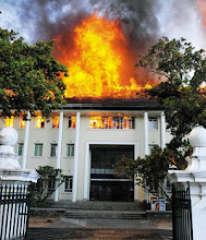 Photo: Dece,ber 11 2010  - A major, historic Stellenbosch University building was torched by failed matriculants who demanded that they be enrolled into courses despite having failed their examinations for them. The ANC-linked SASCO student organisation has launched the campaign in which students use the slogan "Liberation before Education.'