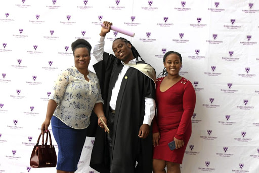 Zolani Bethela, a former petrol attendant, with his proud mother Mvulakazi and younger sister, received an honours degree in industrial sociology at Rhodes University on Saturday. / Supplied