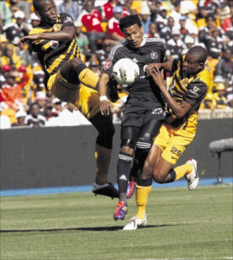 CLOSED DOWN: Tlou Segolela of Orlando Pirates fights for the ball with Thomas Sweswe and Jimmy Jambuo of Kaizer Chiefs. PHOTO: ANTONIO MUCHAVE