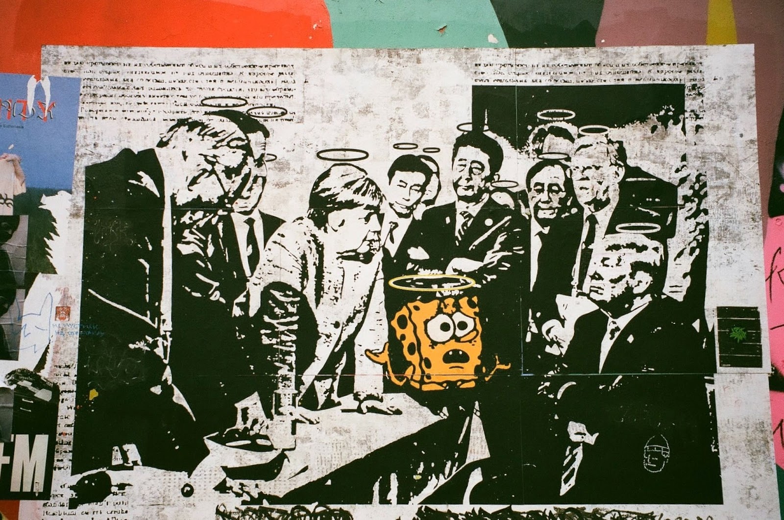 Black and white mural of well-known politicians surrounding a yellow SpongeBob