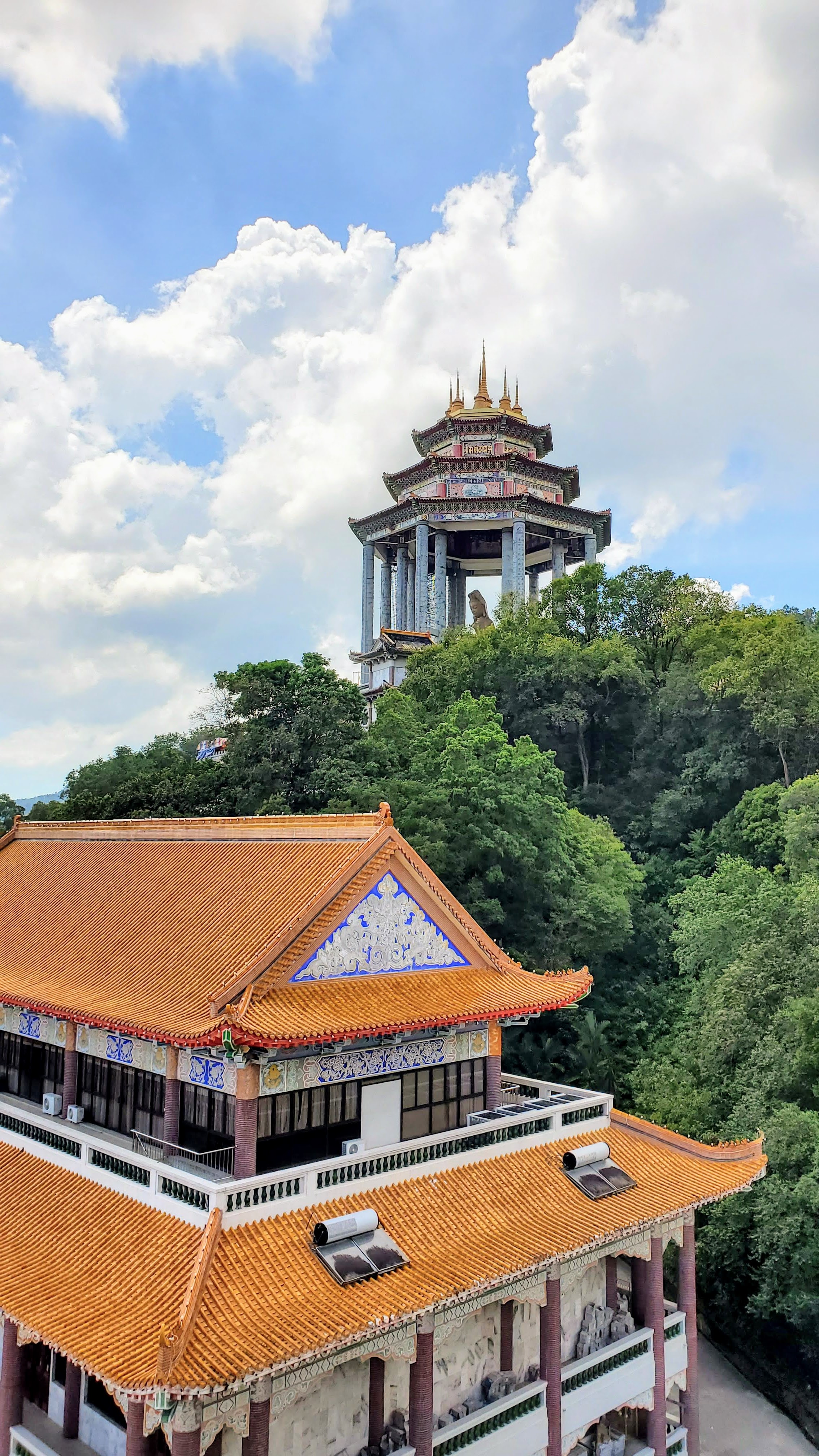 Visiting Kek Lok Si: What makes it unique is that among its millions of Buddhas it shows the blending of cultures that is so representative of Malaysia by including many stylistic representations of Buddha.